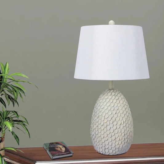 Fangio Lighting's 26.75 in. Resin Table Lamp in an Antique White Finish