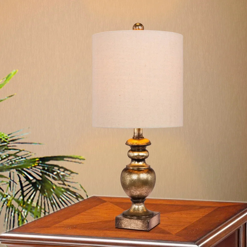 Fangio Lighting's 6235GB 23 in. Textured Urn Resin Table Lamp in a Gold Leaf with Brown Wash Finish