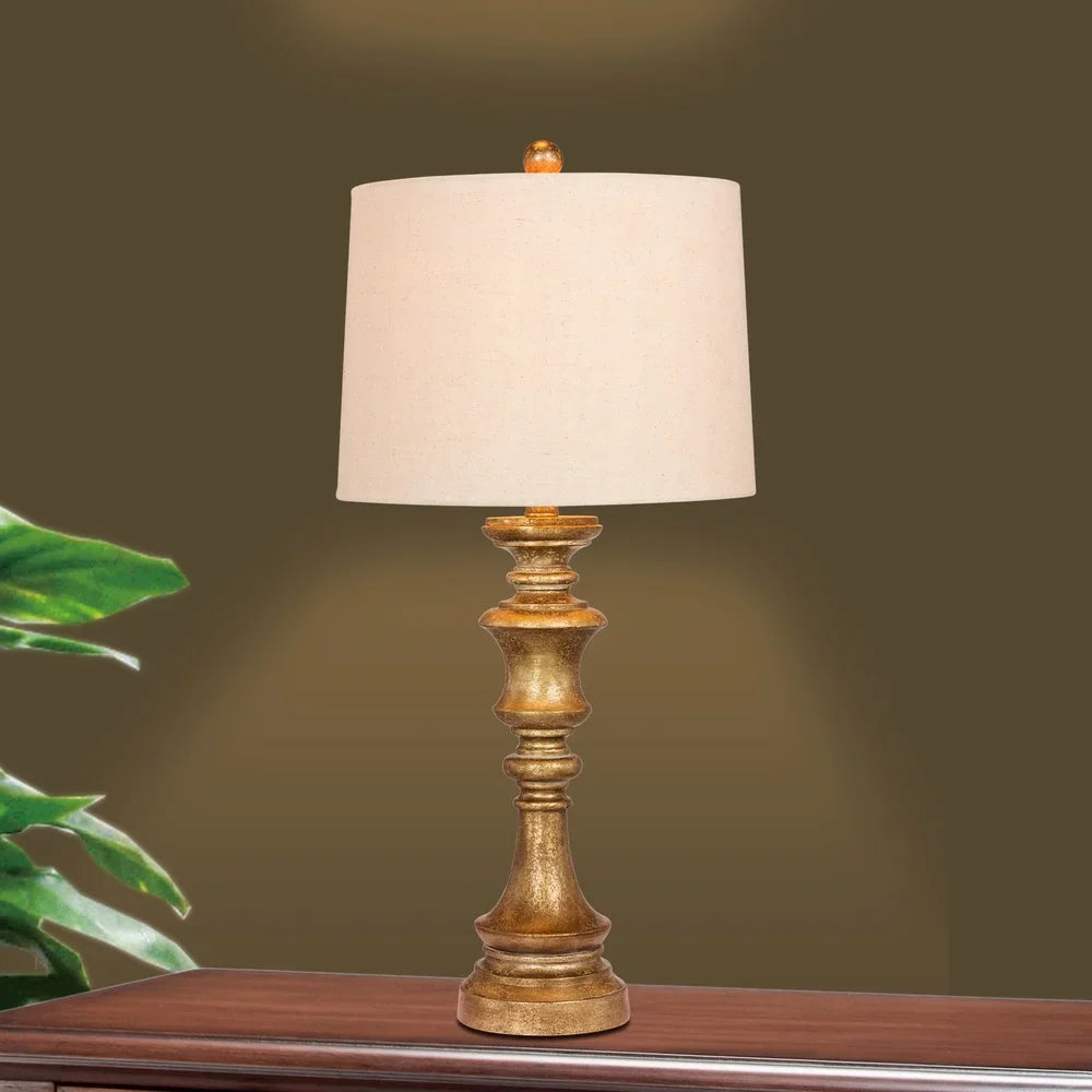 Fangio Lighting's 6236AG 27.75 in. Candlestick Resin Table Lamp in a Antiqued Gold Leaf Finish